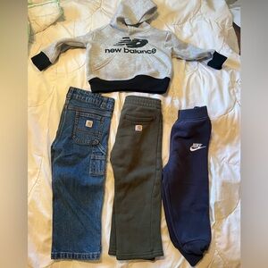 4 pieces, 2 Carhartt pants, Nike pants and New Balance sweatshirt